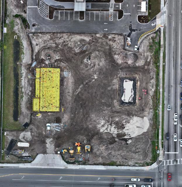 Aerial view of a construction site captured by drone orthophoto, showcasing detailed mapping and project monitoring.