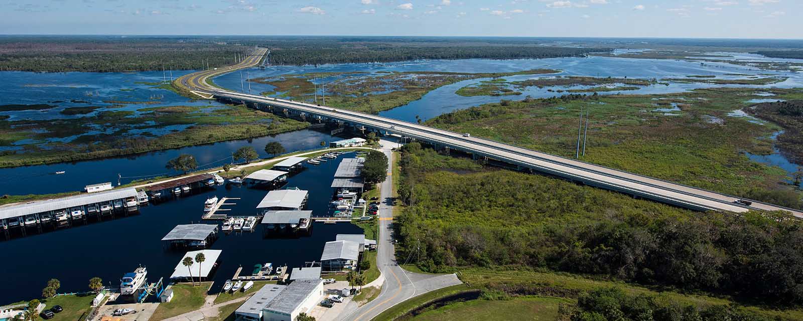 St. Johns River aerial — infrastructure focus Aerial view of St. Johns River in Central Florida, used for project visuals by Skyland Pixels.