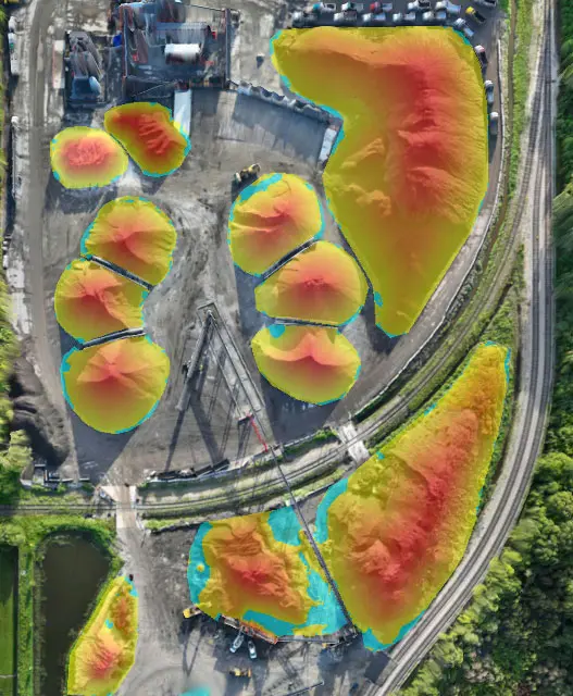 Aerial Orthomosaic volumetric stockpile map with elevation heatmaps of construction site materials in Orlando, Florida.